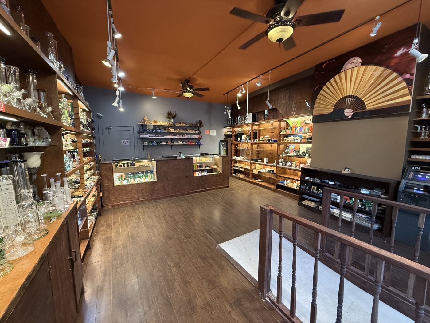 Warm interior with wood shelving and glass displays